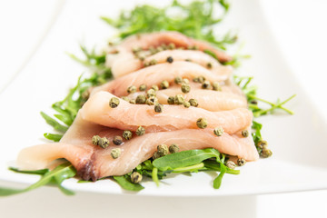 Carpaccio of fresh Mediterranean swordfish with green pepper, chives and a few drops of orange juice
