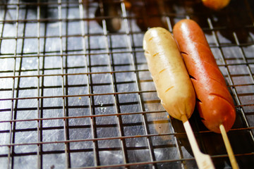 Isaan sausage being grilled on the traditional stove that be a part of street food in Thailand