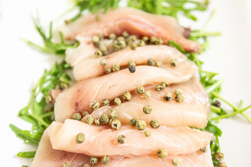 Carpaccio of fresh Mediterranean swordfish with green pepper, chives and a few drops of orange juice