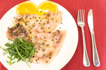 A delicious carpaccio of fresh swordfish, seasoned with extra virgin olive oil, chives and a few...
