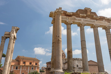 Pillars and ruins of the ancient Saturn Temple in Forum Romanum. Ruins of pillars of Temple of...