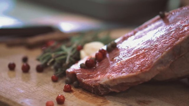 raw beef before grilling rosemary and garlic