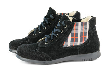 Beautiful female boots made of genuine leather isolated on a white background.