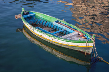 Fototapeta na wymiar Old boat floating on the water