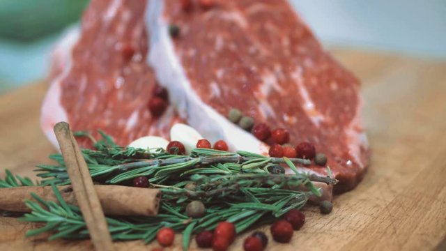 raw beef before grilling rosemary and garlic
