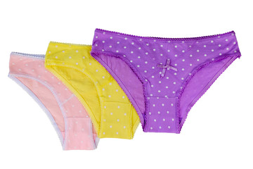 Pink, purple and yellow women's briefs isolated on white background.