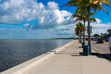 Fototapeta na wymiar Empty waterfront sidewalk along N Roosevelt Blvd in Key West Florida