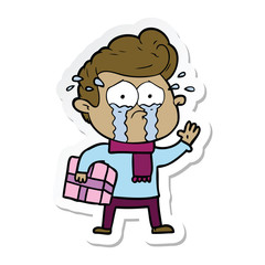 Fototapeta premium sticker of a cartoon crying man with present