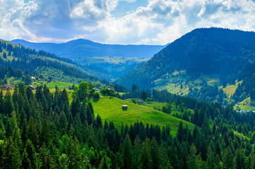 Fototapeta na wymiar beautiful mountain landscape, meadow with a hut among the trees
