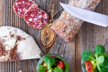 delicious salami from italy on wooden board