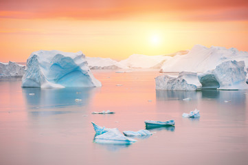 Icebergs in the Atlantic ocean at sunset, Greenland