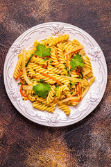 Fusilli pasta with squid, zucchini and carrots