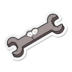 sticker of a cartoon spanner