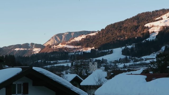 Paragliders in the alp mountains in the winter.