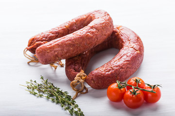 Food, national cuisine and delicious concept - sausages made with horse meat
