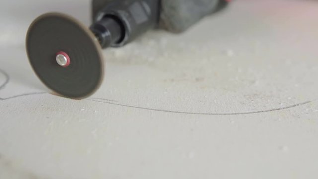 Man work on wood with small circular cutter - 4K Sony a6300 25p S-log2