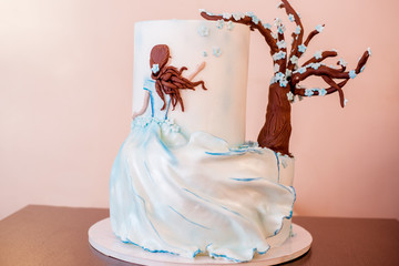 Birthday cake with tree and designed with girl