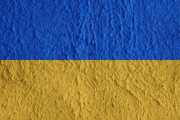Ukraine flag on concrete surface. Creative wallpaper for installation and design.