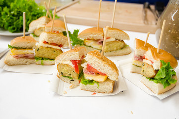 Sliced sandwiches on a disposable paper tray 