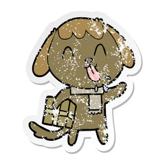 distressed sticker of a cute cartoon dog with christmas present