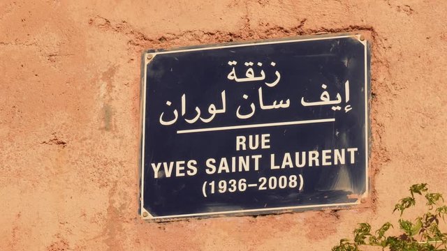 Street sign Rue Yves Saint Laurent in Marrakech, Morocco. North Africa.