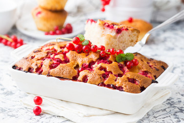 Summer pie with red currant in a white ceramic dish