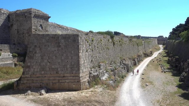 Rhodes, Greece - 21st of April 2018: 4K Touring old town of Rhodes - Top view on the fortress and the road around