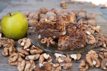 Apple strudel and walnuts nuts.