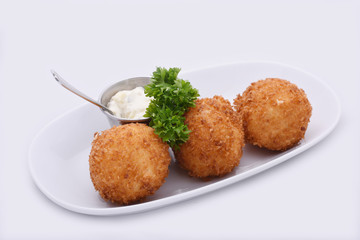 Cheese Balls. Deep fried cheese balls prepared from cow milk cheese with special butter.  On a white background