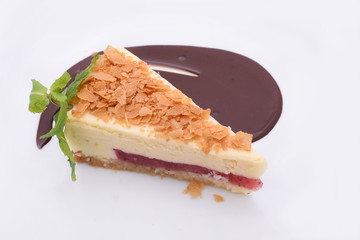 Delicious strawberry cheesecake with chocolate sauce.