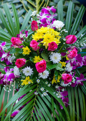 Beautiful flowers background for wedding scene. beautiful bouquet of mixed flowers in a vase on wooden table. the work of the florist at a flower shop. a bright mix of sunflowers.