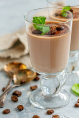 Coffee Panna cotta with a sprig of mint in the glass.