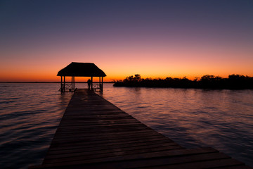 beautiful sunrise, meditation in the lagoon of the seven colors, in Bacalar, Quintana Roo, Mexico.