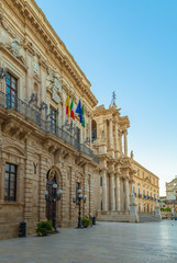 Facade of the historical building in the center of Ortigia island, Syracuse, Sicily, Italy