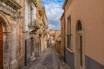 Typical italian narrow street on the island of Sicily in the city Ragusa, Italy