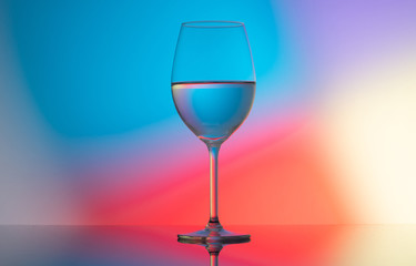 wine glasses dishes on a colored background