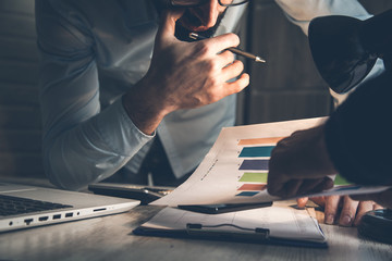 team working in graph on desk