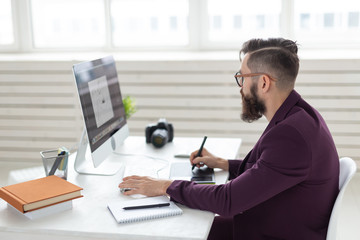 people, design and style concept - graphic designer sketching new project on tablet working on computer