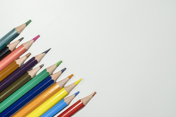 Color pencil with copy space isolated on whtie background,education frame concept.