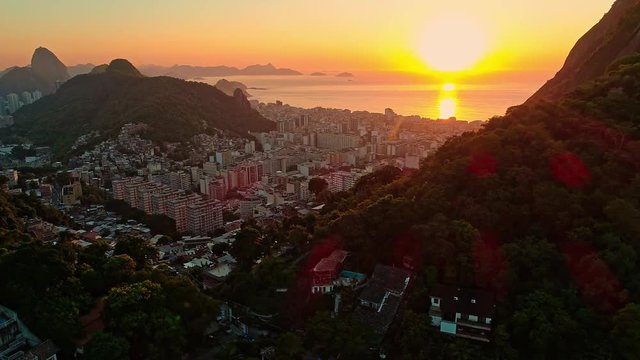 Rio De Janeiro aerial cityscape of the sunset over the coast and Sugarloaf Mountain.