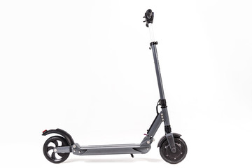 Gray electric scooter. Side view isolated on white.