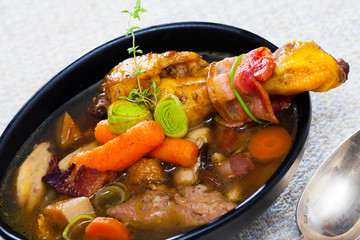 Thick chiken soup with smoked bacon