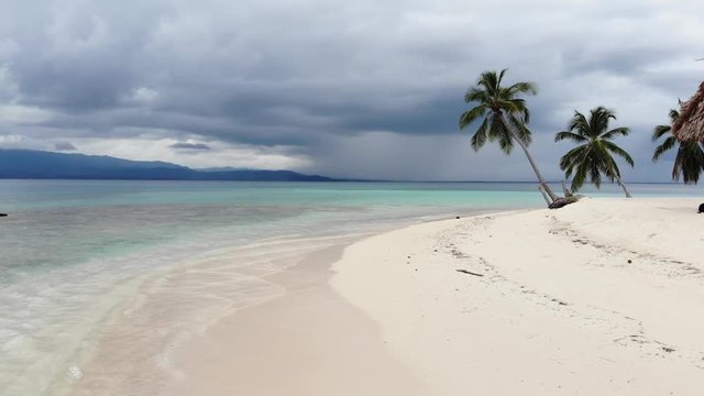aerial low flight ascent over tropical island beach and ocean in San Blas islands Guna Yala Panama