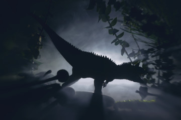 Tyrannosaurus dinosaur is hunting in a night jungle, concept of jurassic period.