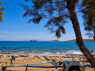 blue ocean with a ship behind