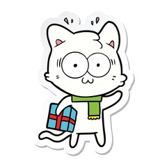 sticker of a cartoon surprised cat with christmas present