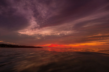 Fototapeta na wymiar Tropical sunset over Water