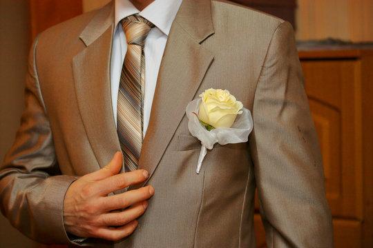Boutonniere on the groom's wedding suit.