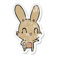 distressed sticker of a cute cartoon rabbit