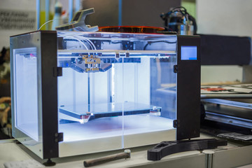 3D printing technology concept - three dimensional printing machine at modern technology exhibition.